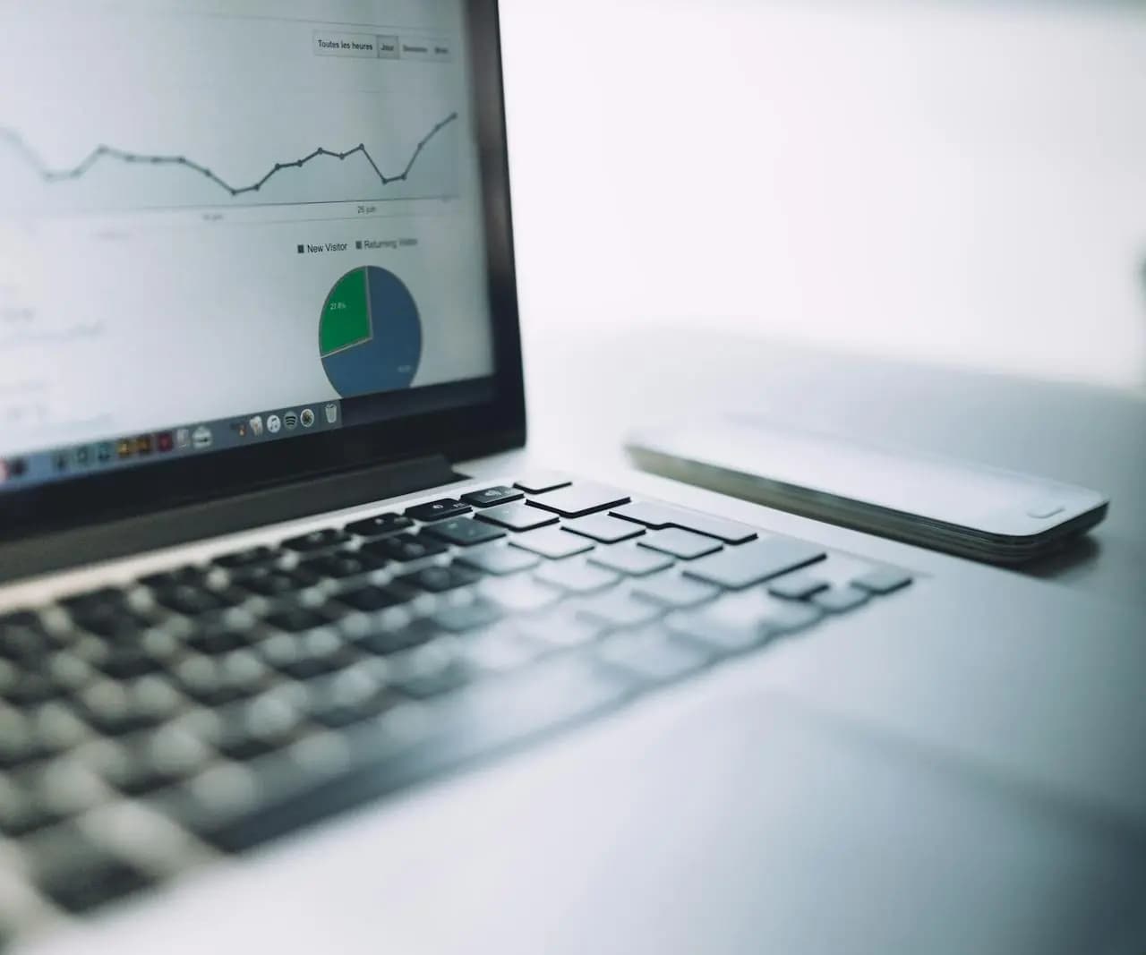 Laptop showing campaign analytics charts and reporting data